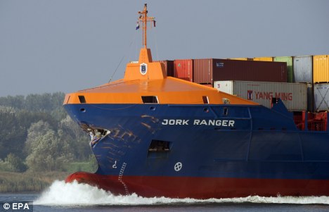 Heading for port: The damaged cargo ship York Ranger passes through River Maass watergate on its way to the harbour in Rotterdam, its original destination