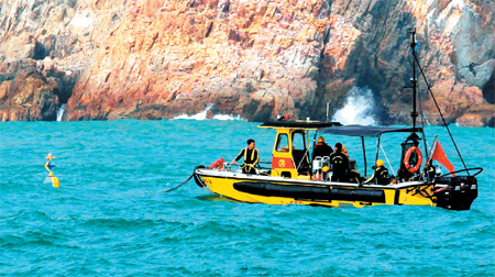  2 dead, 6 missing after ships collide off Tung Lung Chau Rescuers search for the missing mainland crewmen after the collision happened off Tung Lung Chau Tuesday afternoon. Provided to China Daily