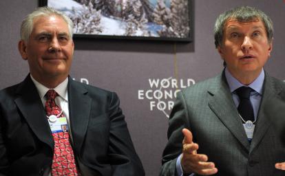 Exxon Mobil Chairman Rex Tillerson (L) listens on Thursday to Russian Deputy Prime Minister Igor Sechin during a press conference at the World Economic Forum in Davos, Switzerland. 