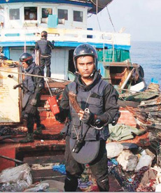 An Indian Navy officer aboard the pirate mother ship that was captured on Sunday.