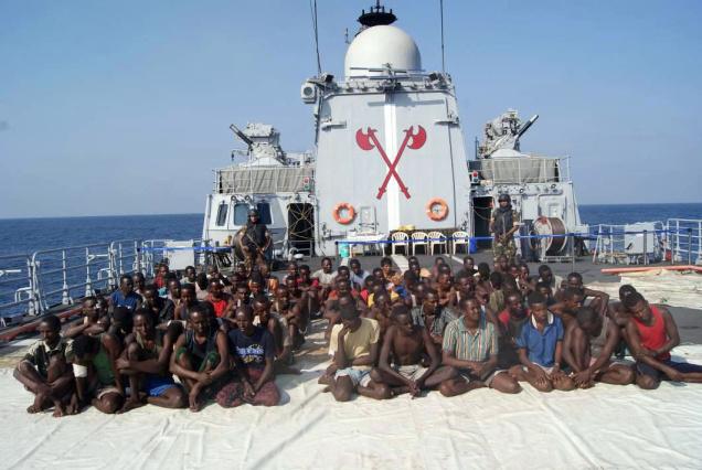 Pirates nabbed by the Navy in the Arabian Sea being brought on warship INS Tabar to Mumbai. Photo courtesy: Indian Navy 