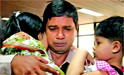 Emotion-choked family members of Abu Naser, a freed sailor of MV Jahan Moni, receive him at Shah Amanat International Airport in Chittagong yesterday. Photo: Anurup Kanti Das