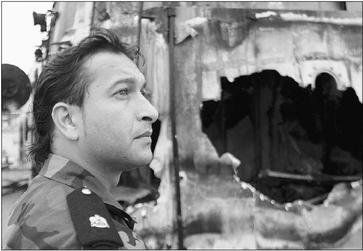  A Libyan sailor inspects damages at the port of Tripoli after NATO's warplanes hit eight vessels.