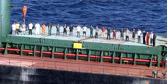A group photo of released crew members including four Pakistanis, six Indians, eleven Egyptians and one Sri Lankan, who were hijacked by Somali Pirates, at a big ship after 10 months of their captivity in Somalia, this picture released by Ansar Burney Trust on Monday, June 13, 2011. – Photo by PPI