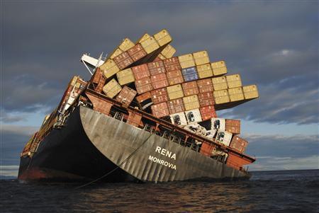 Containers on the stern deck of the 47,230 tonne Liberian-flagged Rena hang precariously, about 12 nautical miles (22 km) from Tauranga, on the east coast of New Zealand's North Island October 20, 2011. The recovery of fuel oil from a stricken container ship grounded off New Zealand resumed on Thursday as salvage teams worked to minimise the damage in the country's worst environmental disaster in decades. Two days of strong winds and high seas had prevented the pumping of oil from the Rena, which has been stuck for more than two weeks on the Astrolabe Reef. 