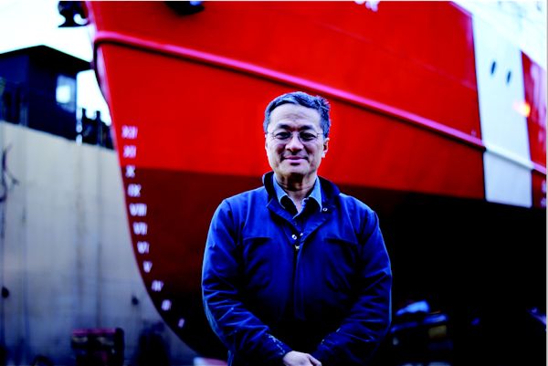 Chuck Ko, the new President and Owner of Allied Shipyards in North Vancouver. Behind him is the Canadian Coast Guard ship 'Vector', in the shipyard for maintenance. Photo Credit: Lucas Morgan