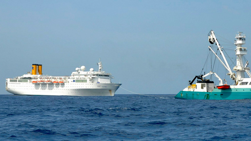 The Costa Allegra, left, is towed by French fishing vessel, The Trevignon, in the Indian Ocean, Tuesday, Feb. 28, 2012. (Le Talenduic, Reunion Island Prefecture)