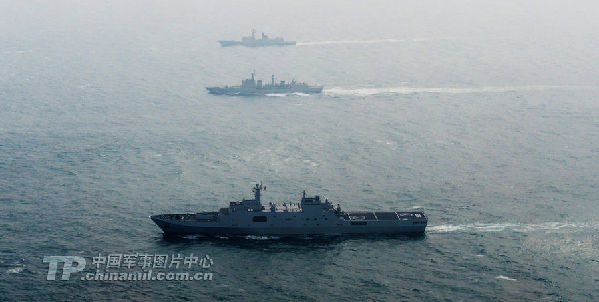 Group sailing: A picture released on Wednesday shows the Liaoning carrier battle group as the nation's first aircraft carrier returns to its home port of Qingdao in Shandong province. (Chinamil.com.cn/Li Jin)