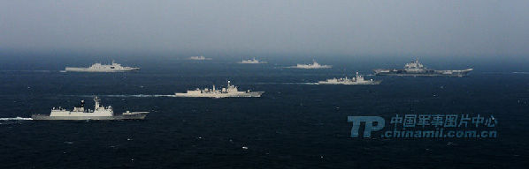 Group sailing: A picture released on Wednesday shows the Liaoning carrier battle group as the nation's first aircraft carrier returns to its home port of Qingdao in Shandong province. (Chinamil.com.cn/Li Jin)