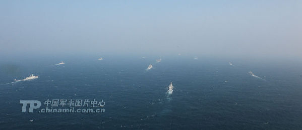 Group sailing: A picture released on Wednesday shows the Liaoning carrier battle group as the nation's first aircraft carrier returns to its home port of Qingdao in Shandong province. (Chinamil.com.cn/Li Jin)