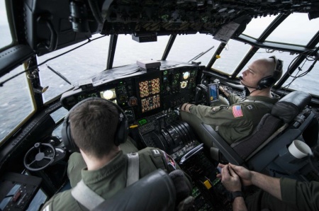 Lt. Michael Angeli, a Coast Guard Air Station Kodiak HC-130 Hercules airplane pilot and other Hercules crew members search the Bering Sea for missing crew members from the South Korean fishing vessel 501 Oryong Dec. 5, 2014.As of Dec. 7, 2014, Coast Guard air and surface assets completed 22 searches, covering 6,000 square miles.U.S. Coast Guard photo by Petty Officer 2nd Class Diana Honings.