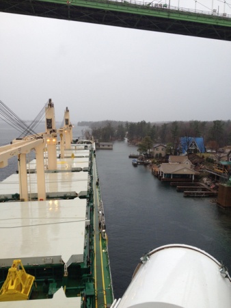 The motor vessel Juno, a 621-foot bulk carrier, sits aground under the Thousand Islands Bridge near Alexandria Bay, New York, April 20, 2015. The vessel ran hard aground after suffering a steering casualty, and at this time there is no pollution reported. (U.S. Coast Guard photo)